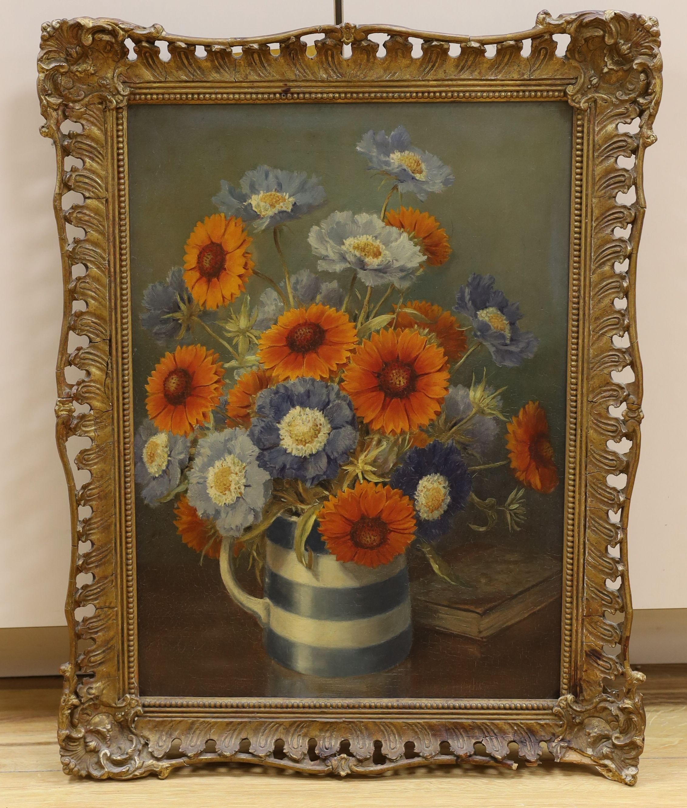 English School c.1910, oil on canvas, Still life of flowers in a Cornish ware jug, 50 x 36cm